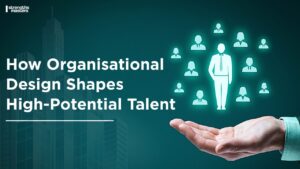 Graphic banner with the text “How Organisational Design Shapes High-Potential Talent,” featuring a hand holding up a central leader icon surrounded by smaller employee icons, with the Strengths Masters logo in the corner.