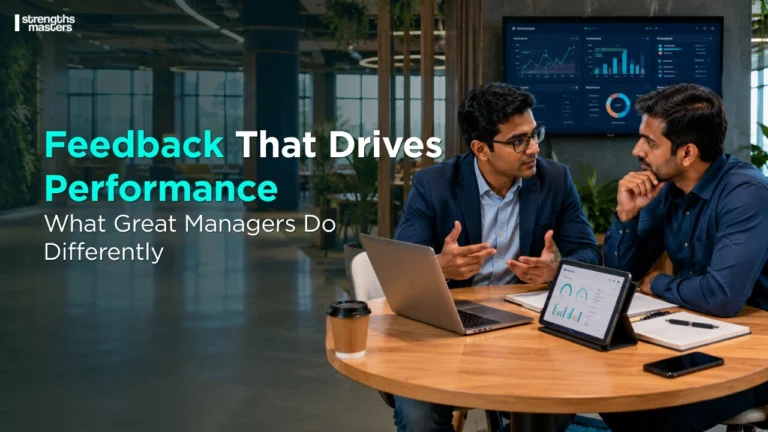 Feedback That Drives Performance: Managers in a modern workplace coaching an employee during a constructive one-on-one discussion focused on growth and accountability.