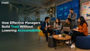 Managers collaborating in a vibrant, modern office lounge, building trust and accountability in an open, creative workspace.